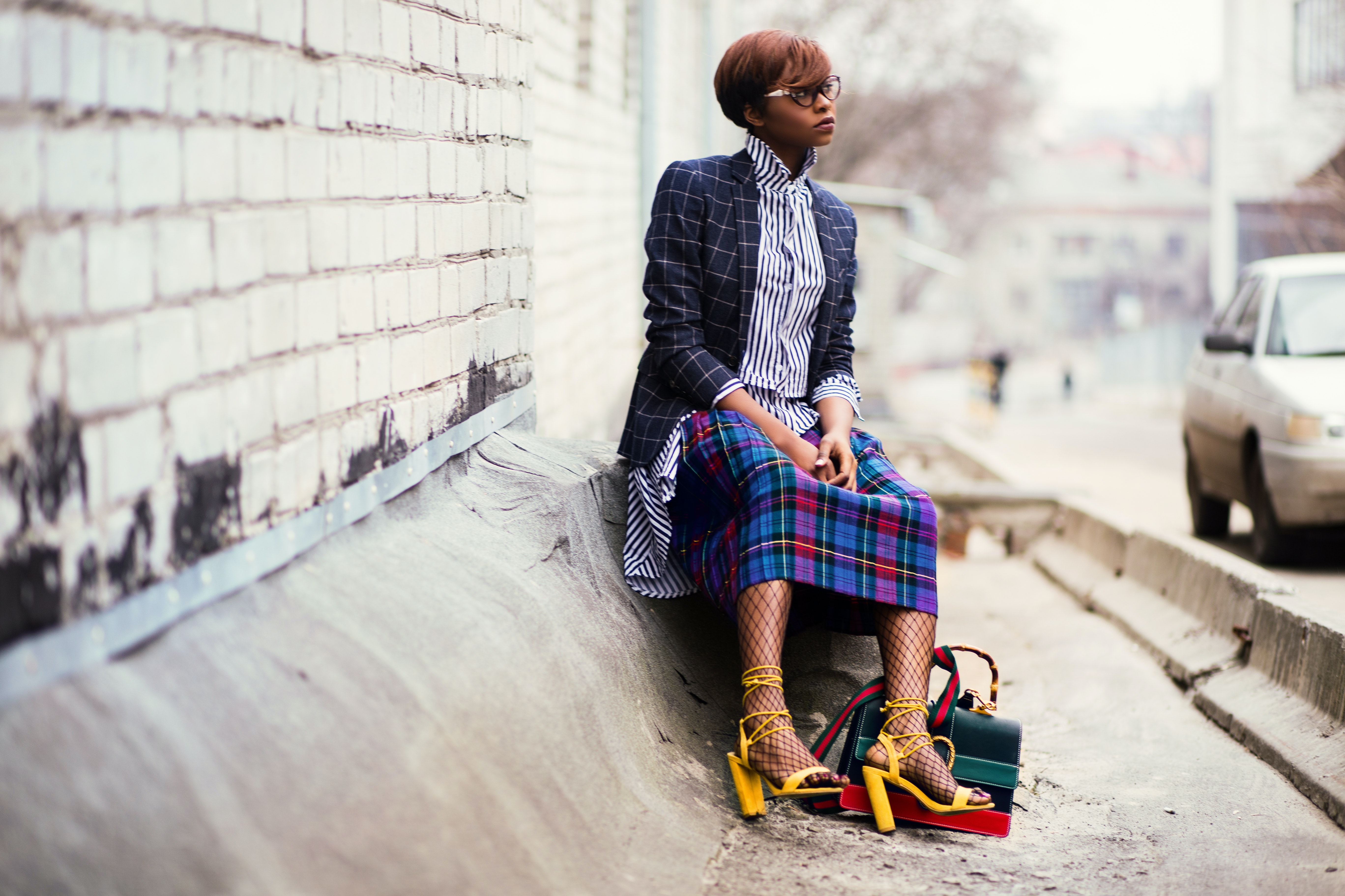 stylish black woman sitting