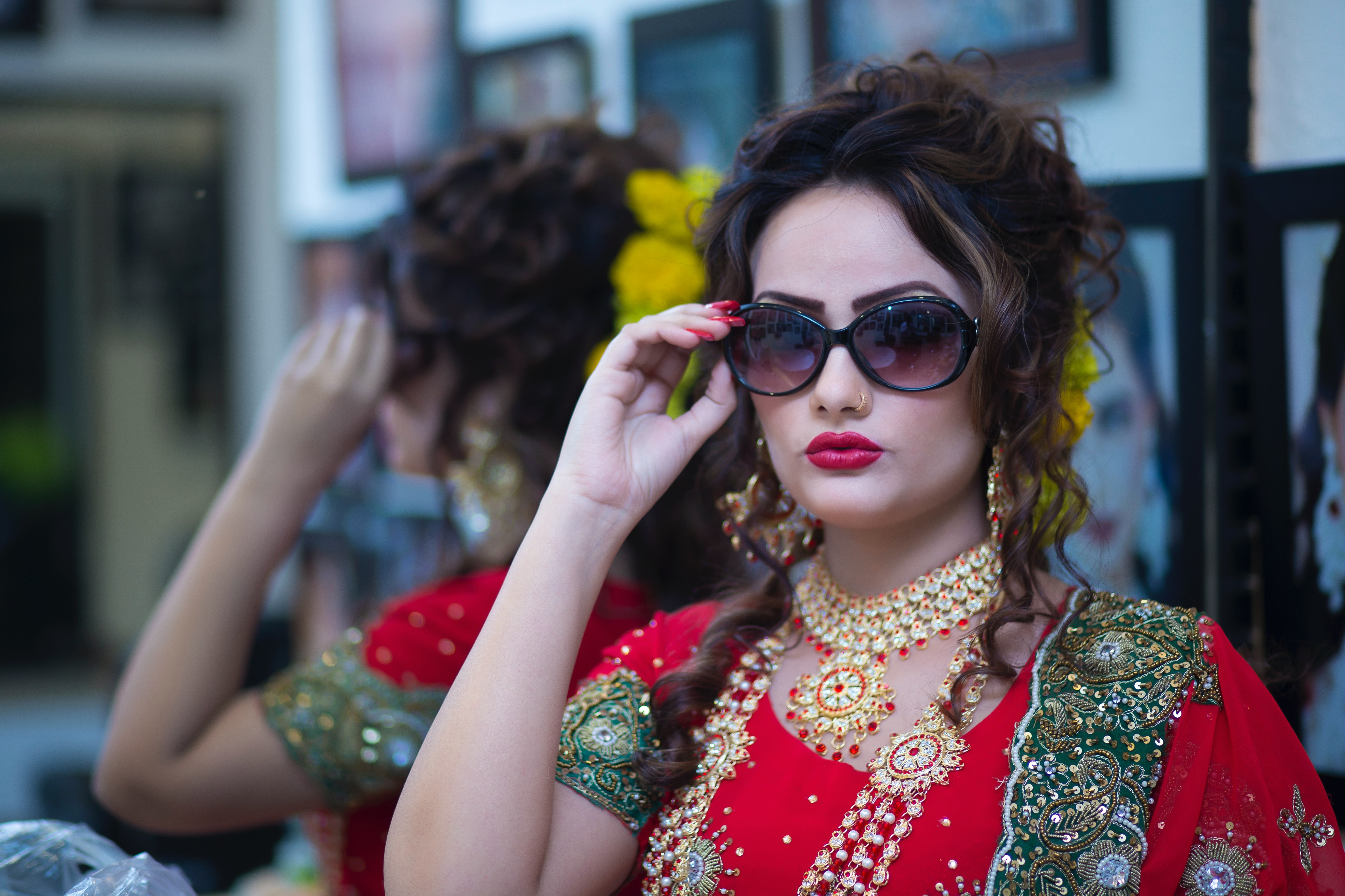 woman in traditional attire wearing sunglasses