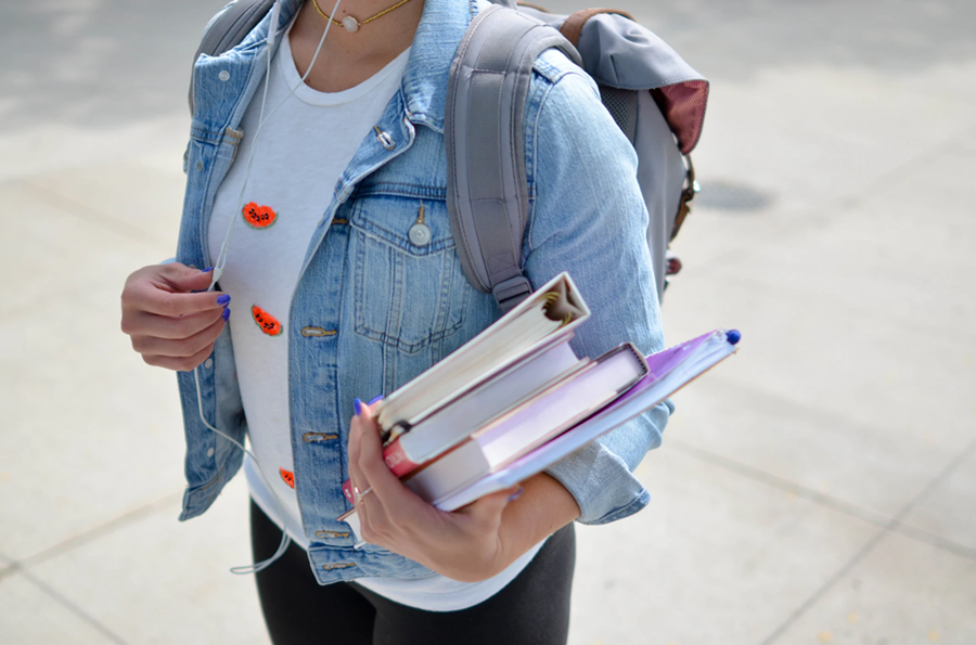 female-student-with-books-and-a-backpack